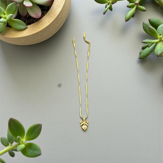 Bow heart pendant
